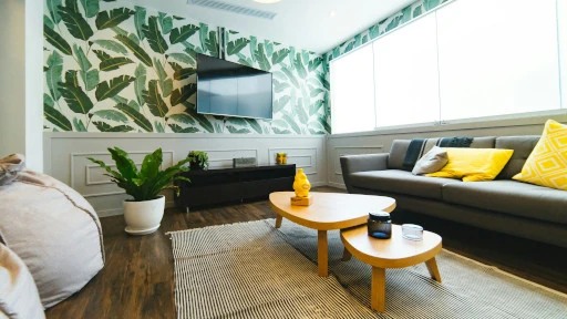 jungle themed room with a television mounted on the wall