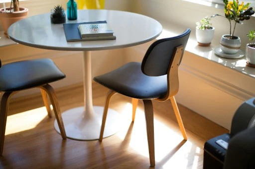 a table and chairs near the window