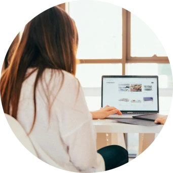 woman using a notebook computer at the table