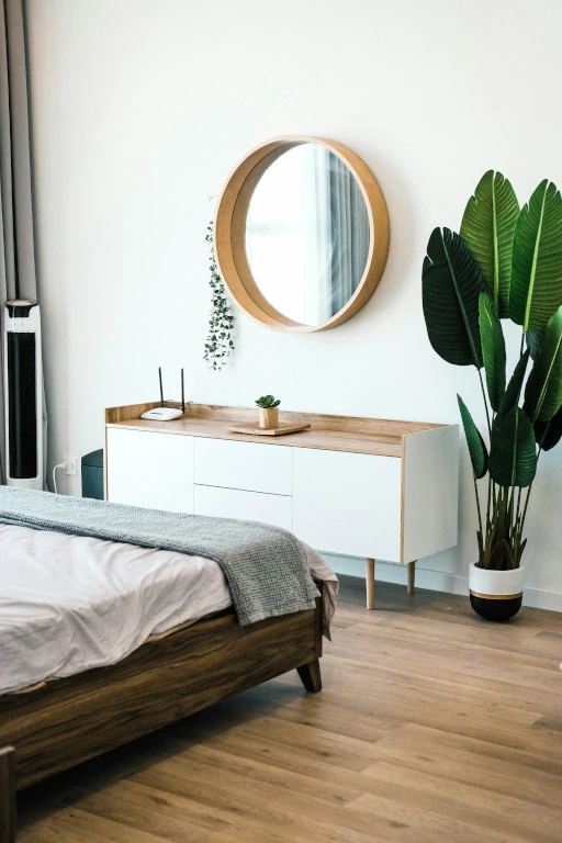 well lit bedroom white walls with earth tone accents